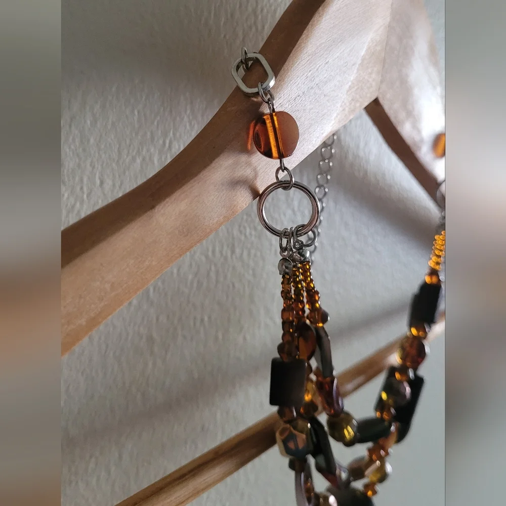 Multi strand silver and amber beaded necklace